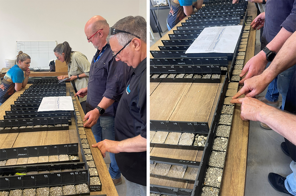 people viewing rock and soil samples in trays