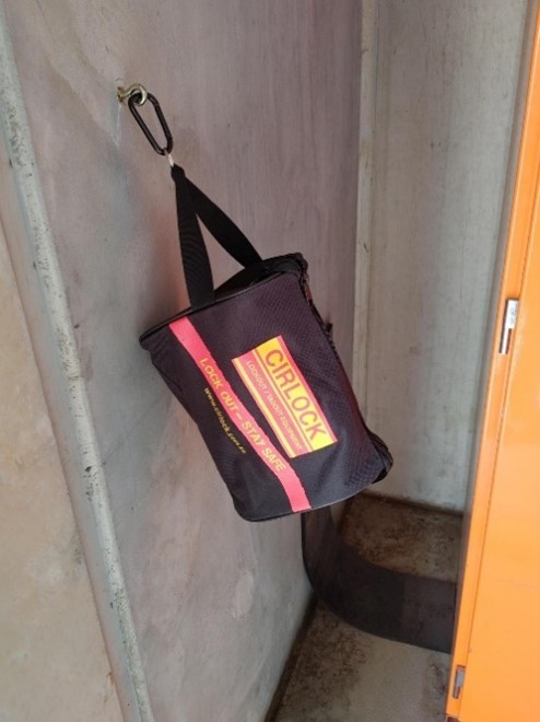 Photo of Lock out tag out equipment hanging from a wall.