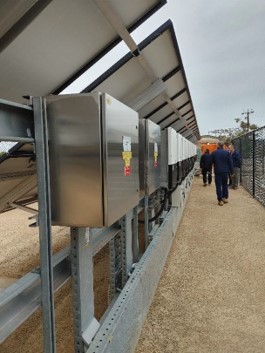 Photo of OTR Officers inspecting UniSA Mawson Lakes solar equipment with site representatives